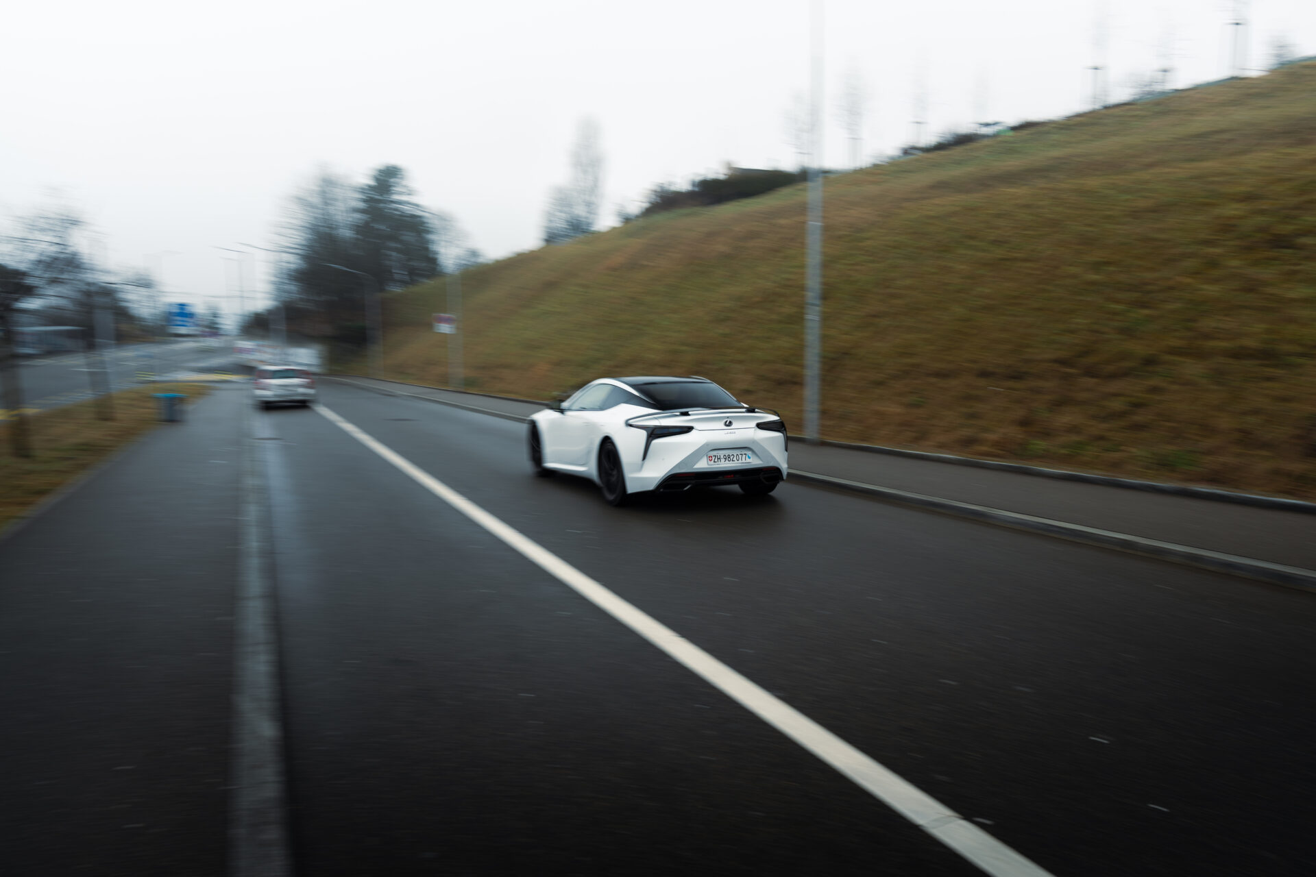 Rolling shot of a Lexus LC500 Ultimate Edition in action