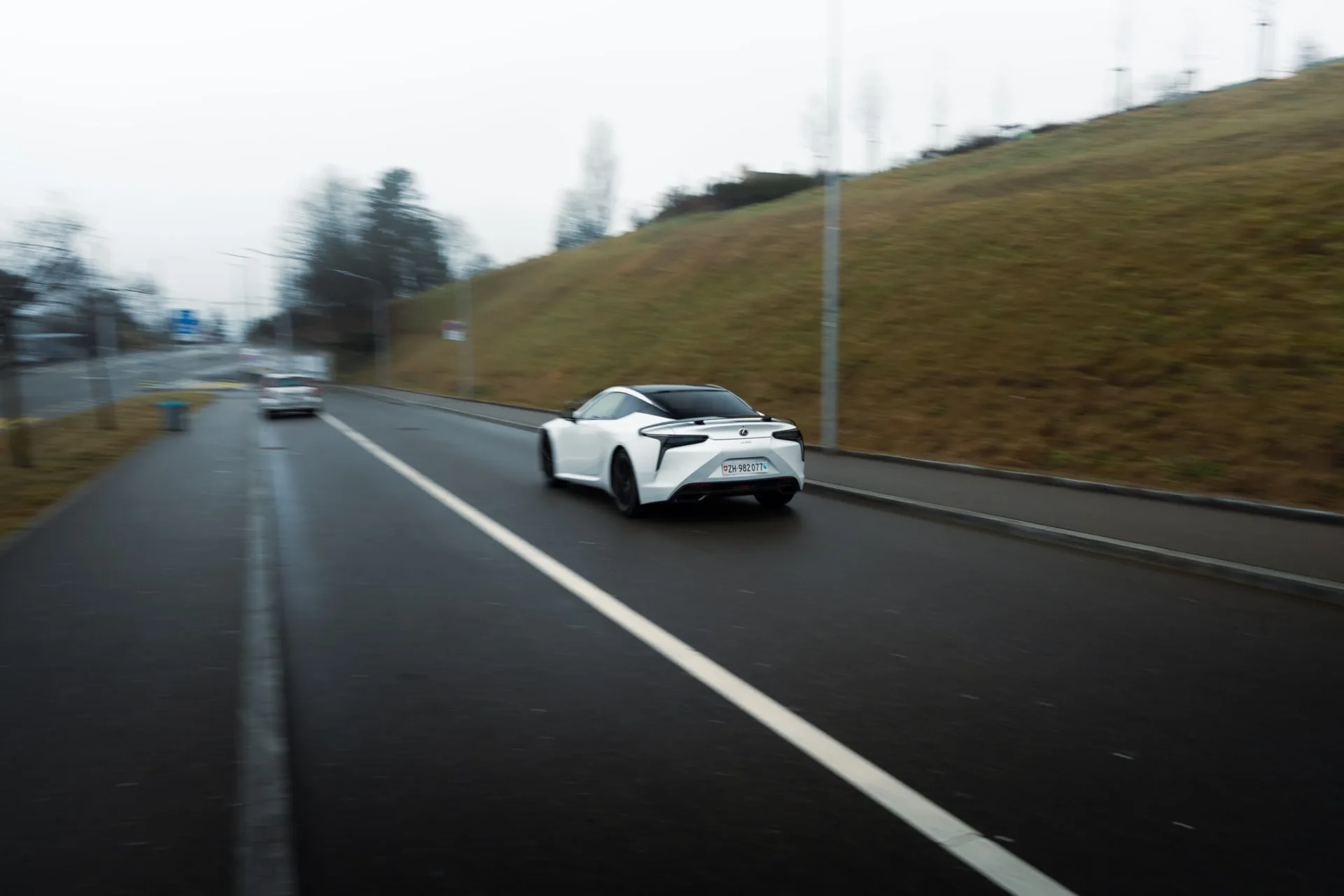 Rolling shot of a Lexus LC500 Ultimate Edition in action