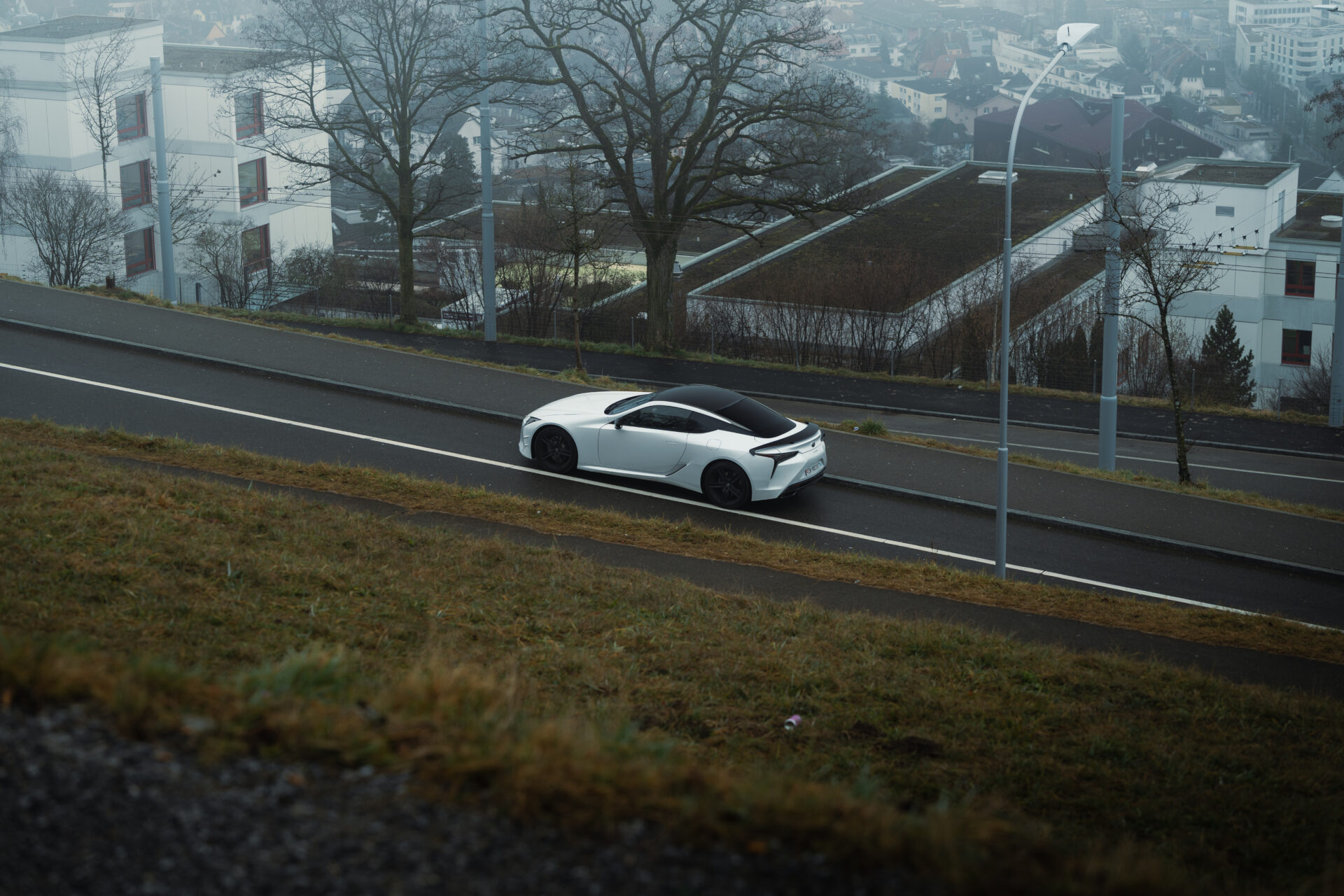 A foggy day in Zurich, Switzerland with a Lexus LC500 Ultimate Edition in the foreground