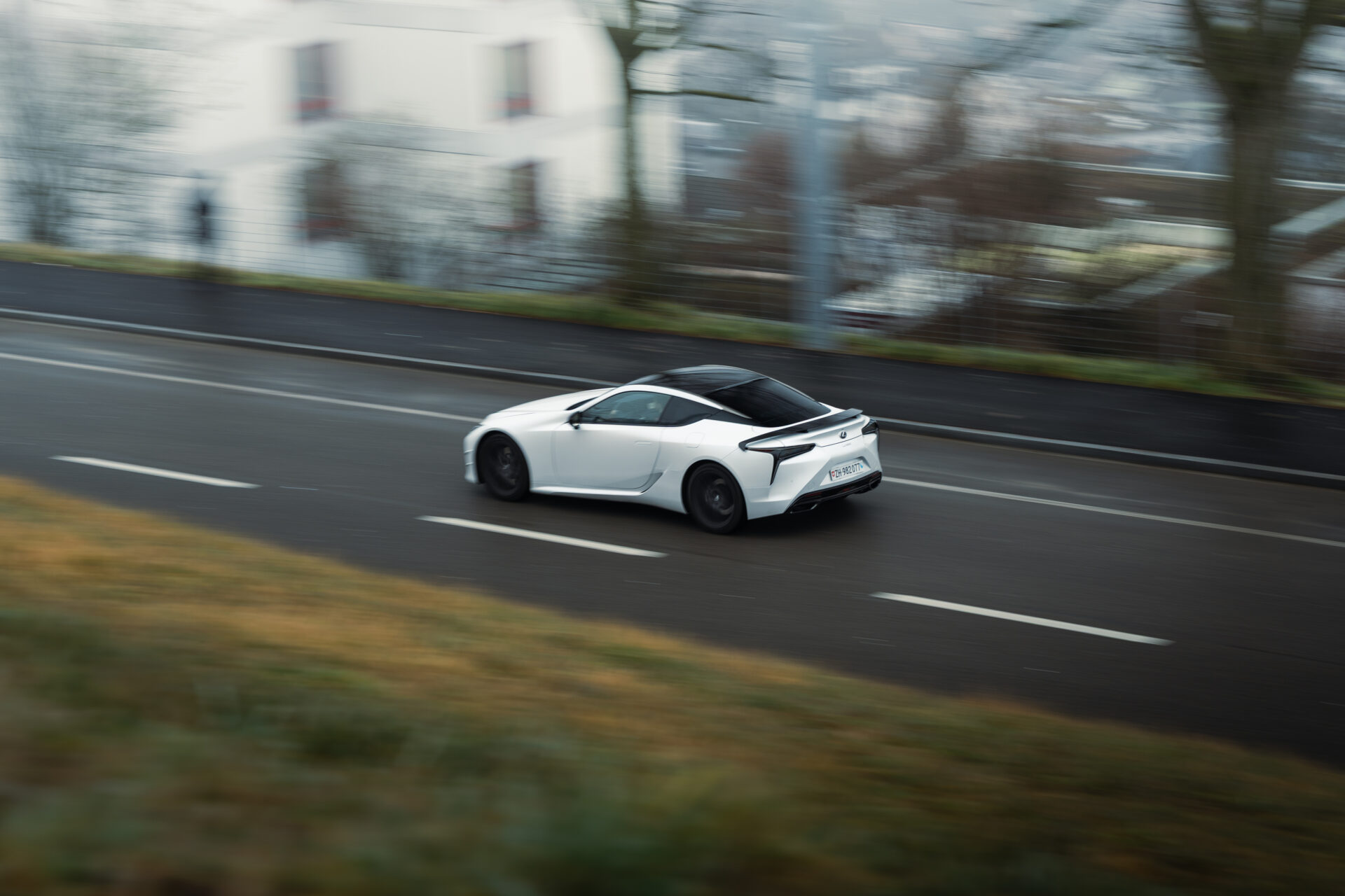 Rolling shot of a Lexus LC500 Ultimate Edition in action