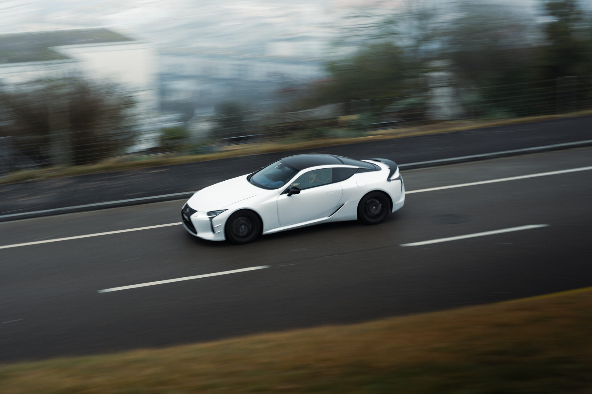 Rolling shot of a Lexus LC500 Ultimate Edition in action
