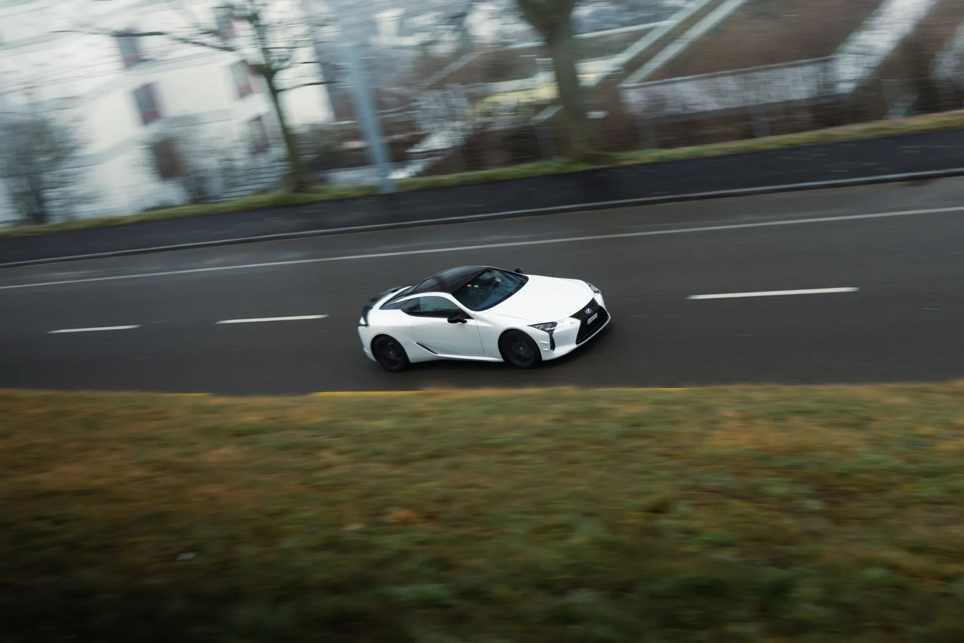 Rolling shot of a Lexus LC500 Ultimate Edition in action