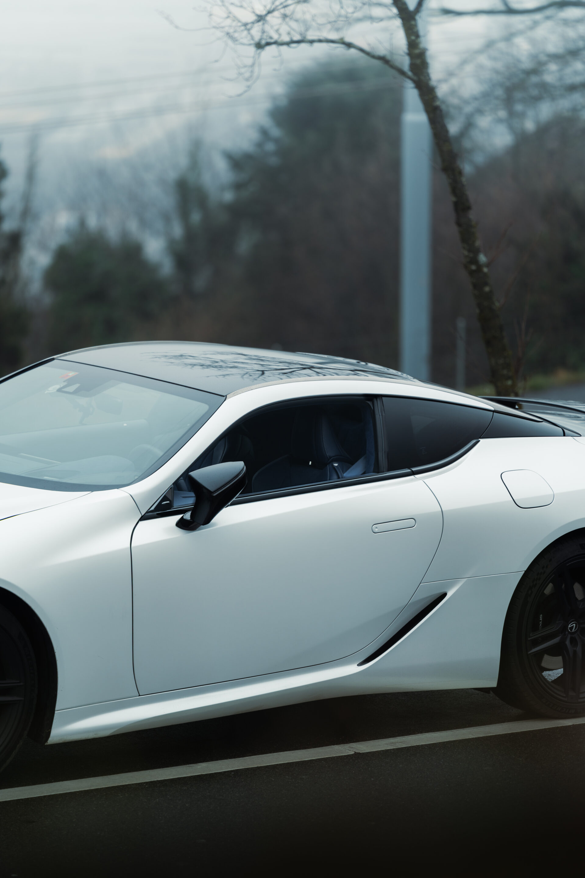 A foggy day in Zurich, Switzerland with a Lexus LC500 Ultimate Edition in the foreground