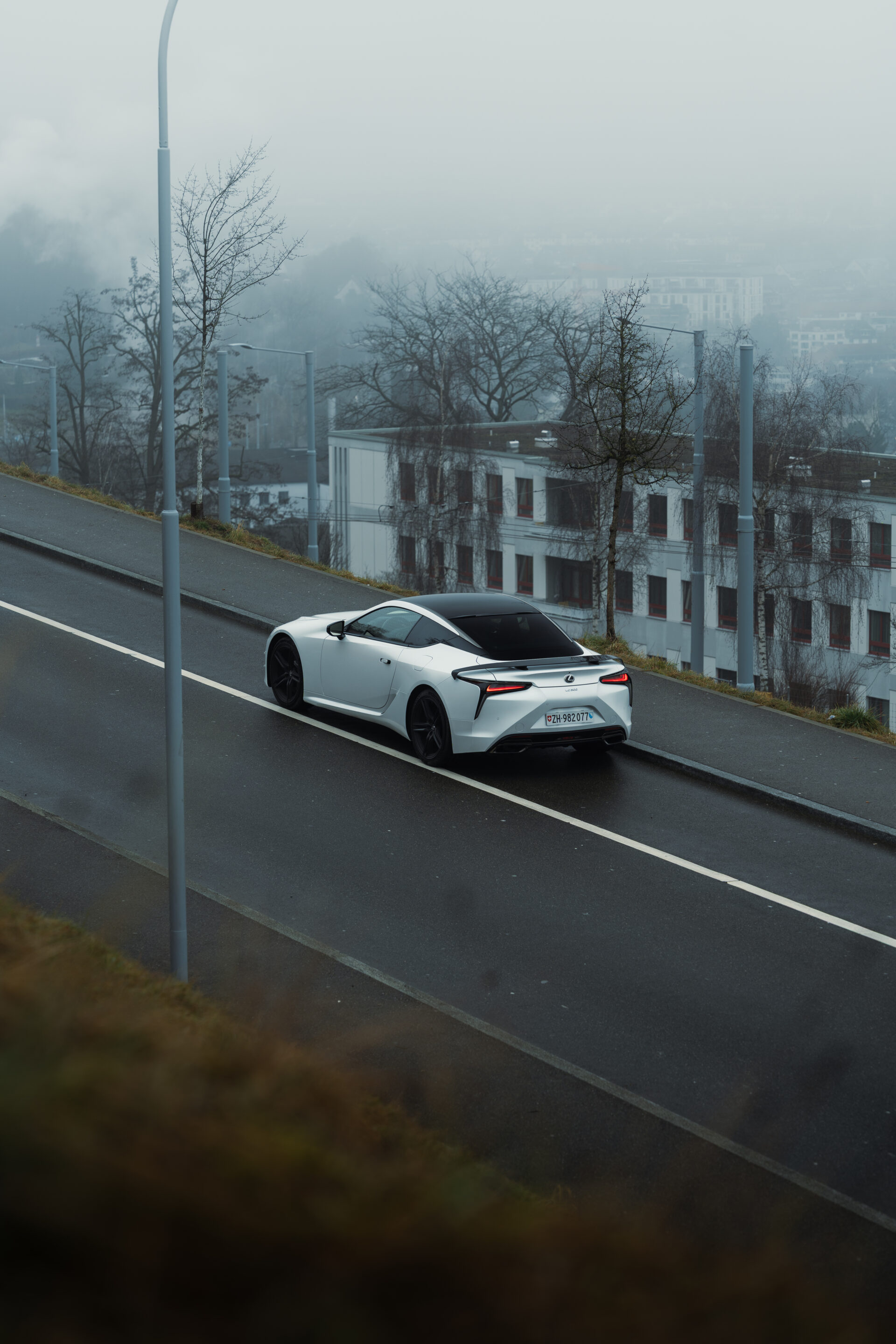 A foggy day in Zurich, Switzerland with a Lexus LC500 Ultimate Edition in the foreground